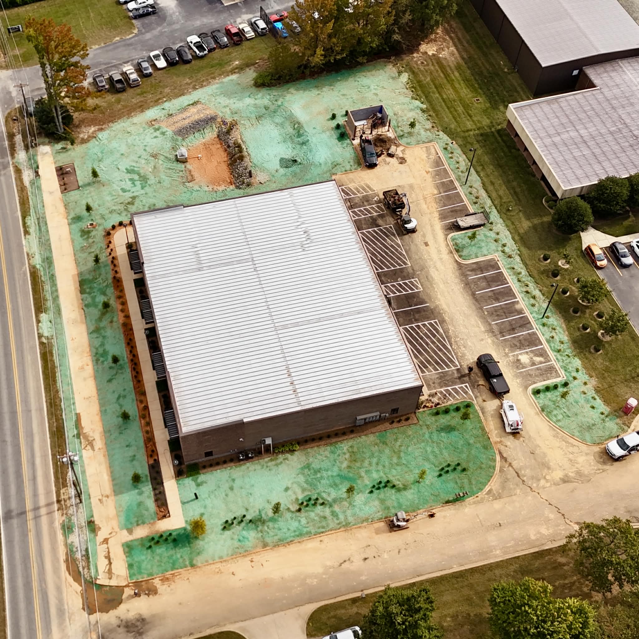 Aerial view of hydroseeded grounds surrounding a large commercial warehouse building